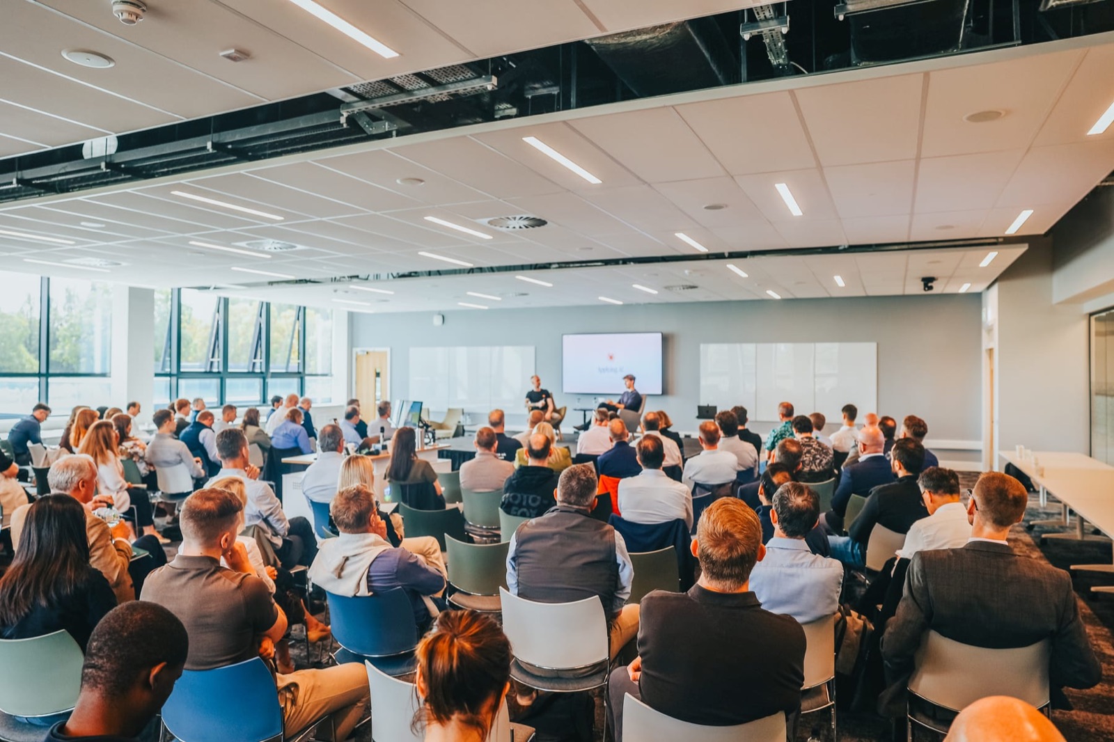 The room at Waypoint Dublin, the audience seated and facing the stage at UCD